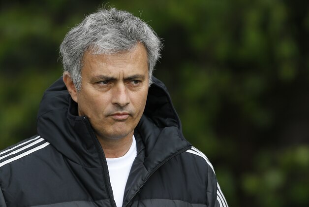 Chelsea manager Jose Mourinho arrives for a training session at Cobham in England, Tuesday, April 29, 2014. Chelsea will play a Champions League semifinal second leg soccer match against Atletico Madrid on Wednesday. (AP Photo/Kirsty Wigglesworth)