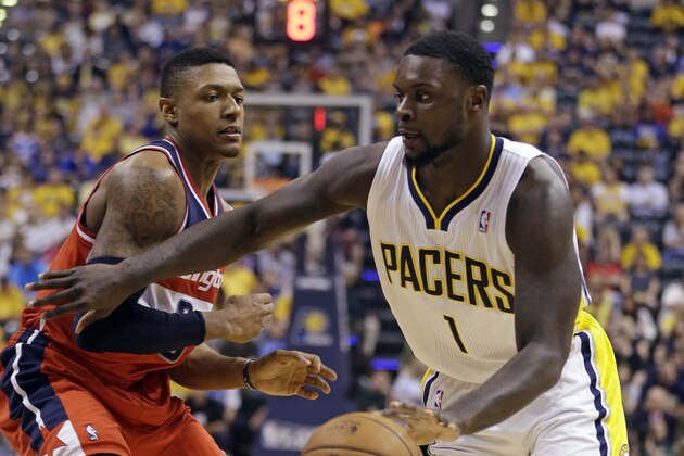 Indiana Pacers guard Lance Stephenson, right, drives on Washington Wizards guard Bradley Beal during the second half of game 5 of the Eastern Conference semifinal NBA basketball playoff series Tuesday, May 13, 2014, in Indianapolis. (AP Photo/Darron Cummings)