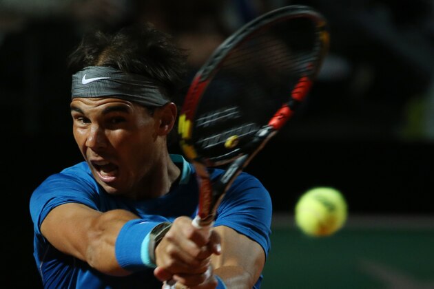 Spain's Rafael Nadal returns a backhand to Britain's Andy Murray during their match at the Italian open tennis tournament in Rome, Friday, May 16, 2014. (AP Photo/Gregorio Borgia)