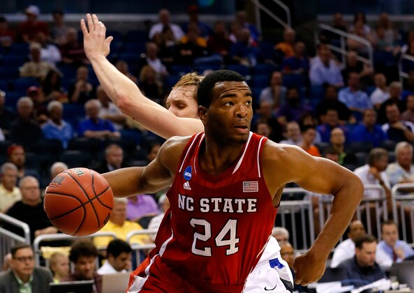 ORLANDO, FL - MARCH 20:  T.J. Warren #24 of the North Carolina State Wolfpack drives to the basket against Jake Barnett #30 of the Saint Louis Billikens during the second round of the 2014 NCAA Men's Basketball Tournament at Amway Center on March 20, 2014 in Orlando, Florida.  (Photo by Kevin C. Cox/Getty Images)