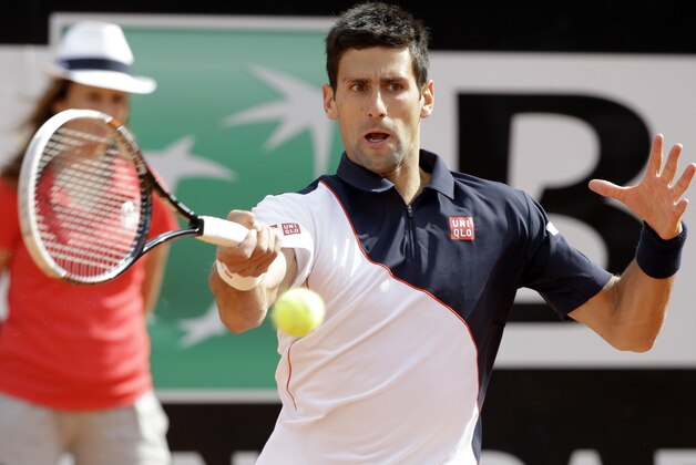 Serbia's Novak Djokovic returns the ball to Spain's Rafael Nadal during their final match at the Italian Open tennis tournament, in Rome, Sunday, May 18, 2014. (AP Photo/Andrew Medichini)