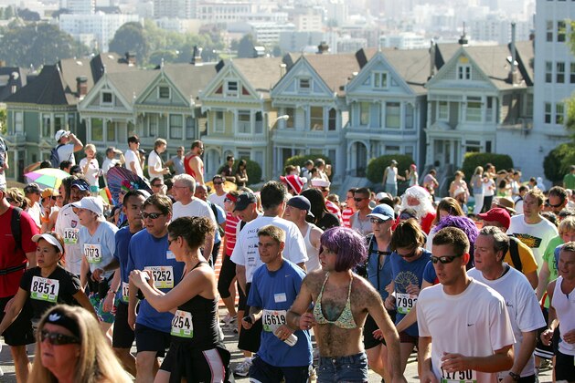 SAN FRANCISCO - MAY 17:  Participants run up Hayes Street Hill with the backdrop of the city's 'Painted Ladies' houses during the ING Bay to Breakers race May 17, 2009 in San Francisco, California.  Now in its 98th year, the ING Bay to Breakers 12K is one of the world's largest and oldest footraces, featuring world-class athletes in addition to costumed runners.  (Photo by Ezra Shaw/Getty Images)