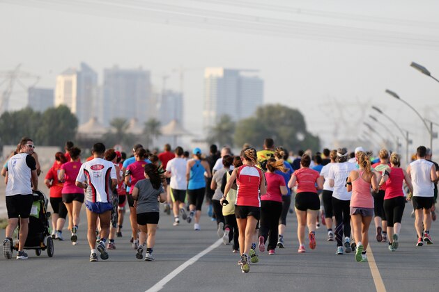 DUBAI, UNITED ARAB EMIRATES - MAY 04:  Competitors take part in the 10km Wings for Life World Run at Nad Al Sheba Cycle Park on May 4, 2014 in Dubai, United Arab Emirates.  (Photo by Francois Nel/Getty Images)