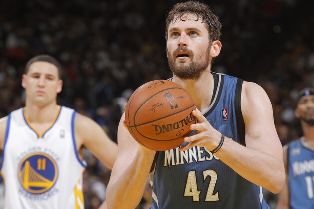 OAKLAND, CA - APRIL 14: Kevin Love #42 of the Minnesota Timberwolves shoots a free throw against the Golden State Warriors on April 14, 2014 at Oracle Arena in Oakland, California. NOTE TO USER: User expressly acknowledges and agrees that, by downloading and or using this photograph, user is consenting to the terms and conditions of Getty Images License Agreement. Mandatory Copyright Notice: Copyright 2014 NBAE (Photo by Rocky Widner/NBAE via Getty Images)