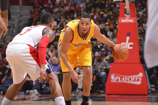 WASHINGTON, DC - MAY 09: Evan Turner #12 of the Indiana Pacers dribbles the ball against Bradley Beal #3 of the Washington Wizards during Game Three of the Eastern Conference Semifinals at Verizon Center on May 9, 2014 in Washington, DC. NOTE TO USER: User expressly acknowledges and agrees that, by downloading and or using this photograph, User is consenting to the terms and conditions of the Getty Images License Agreement. Mandatory Copyright Notice: Copyright 2014 NBAE  (Photo by David Dow/NBAE via Getty Images)