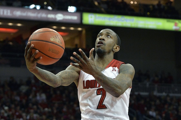 Louisville's Russ Smith goes in for a layup during the second half of an NCAA college basketball game Thursday, Jan. 16, 2014, in Louisville, Ky. Louisville defeated Houston 91-52. (AP Photo/Timothy D. Easley)