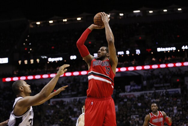 May 14, 2014; San Antonio, TX, USA; Portland Trail Blazers forward LaMarcus Aldridge (12) shoots the ball over San Antonio Spurs forward Boris Diaw (33) in game five of the second round of the 2014 NBA Playoffs at AT&T Center. The Spurs won 104-82. Mandatory Credit: Soobum Im-USA TODAY Sports