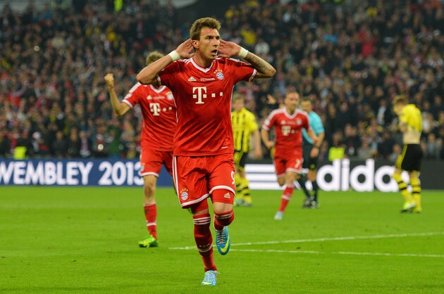 LONDON, ENGLAND - MAY 25:  Mario Mandzukic of Bayern Muenchen celebrates as he scores their first goal during the UEFA Champions League final match between Borussia Dortmund and FC Bayern Muenchen at Wembley Stadium on May 25, 2013 in London, United Kingdom.  (Photo by Shaun Botterill/Getty Images)