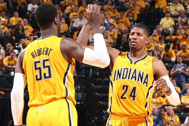 INDIANAPOLIS - MAY 18: Paul George #24 and Roy Hibbert #55 of the Indiana Pacers give eachother high fives against the Miami Heat in game one of the East Conference Finals at Bankers Life Fieldhouse on May 18, 2014 in Indianapolis, Indiana.  NOTE TO USER: User expressly acknowledges and agrees that, by downloading and or using this Photograph, user is consenting to the terms and condition of the Getty Images License Agreement. Mandatory Copyright Notice: 2014 NBAE  (Photo by Nathaniel S. Butler/NBAE via Getty Images)