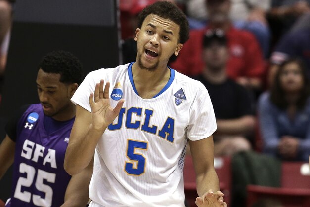 UCLA's Kyle Anderson urges on his team during the second half of a third-round game against Stephen F. Austin in the NCAA college basketball tournament, Sunday, March 23, 2014, in San Diego. (AP Photo/Gregory Bull)