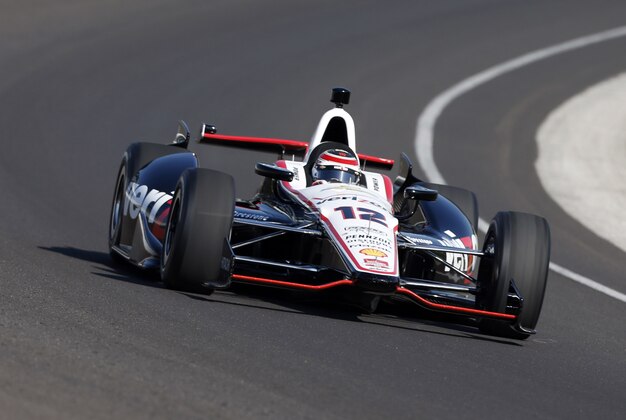 May 18, 2014; Indianapolis, IN, USA; IndyCar Series driver Will Power drives through turn one during pole day for the 2014 Indianapolis 500 at Indianapolis Motor Speedway. Mandatory Credit: Brian Spurlock-USA TODAY Sports