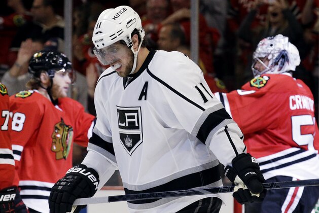 Los Angeles Kings' Anze Kopitar (11) reacts as he leaves the ice after his team's 3-1 loss to the Chicago Blackhawks in Game 1 of the Western Conference finals in the NHL hockey Stanley Cup playoffs in Chicago on Sunday, May 18, 2014. The Blackhawks won 3-1. (AP Photo/Nam Y. Huh)