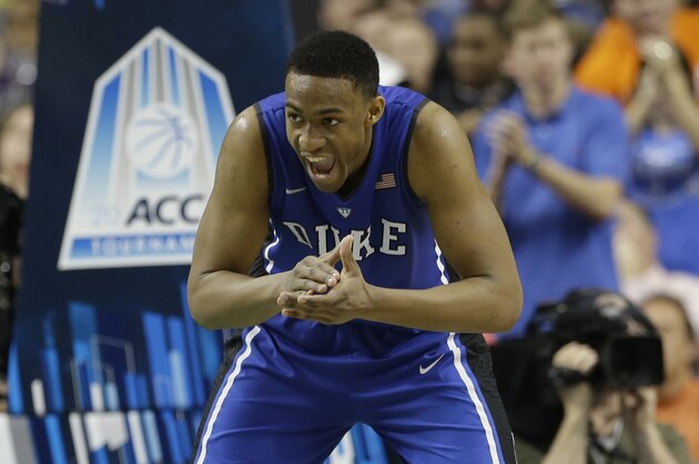 Duke's Jabari Parker reacts after making a basket against Virginia during the second half of an NCAA college basketball game in the championship of the Atlantic Coast Conference tournament in Greensboro, N.C., Sunday, March 16, 2014. (AP Photo/Gerry Broome)