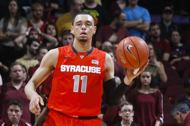Syracuse guard Tyler Ennis (11) dribbles the ball in the second half of an NCAA college basketball game against Florida State Sunday, March 9, 2014, at the Donald L. Tucker Center in Tallahassee, Fla. Syracuse defeated Florida State 74-58. (AP Photo/Phil Sears)