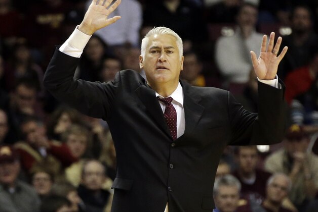 Montana head coach Wayne Tinkle directs his team in the first half of an NCAA college basketball game against Minnesota, Tuesday, Nov. 12, 2013 in Minneapolis. (AP Photo/Jim Mone)