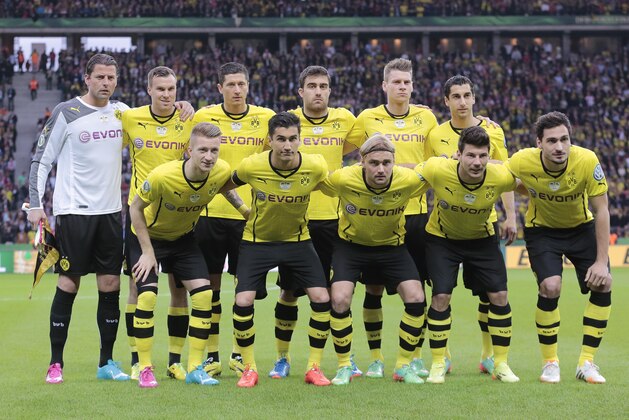 The soccer team of Borussia Dortmund pose prior to the German Soccer Cup Final between FC Bayern Munich and Borussia Dortmund at the Olympic Stadium Berlin, Germany, Saturday, May 17, 2014. (AP Photo/Markus Schreiber)