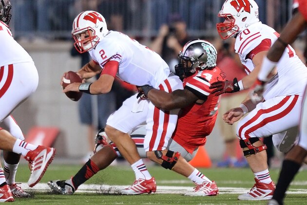 COLUMBUS, OH - SEPTEMBER 28:  Curtis Grant #14 of the Ohio State Buckeyes sacks quarterback Joel Stave #2 of the Wisconsin Badgers in the third quarter at Ohio Stadium on September 28, 2013 in Columbus, Ohio. Ohio State defeated Wisconsin 31-24.   (Photo by Jamie Sabau/Getty Images)