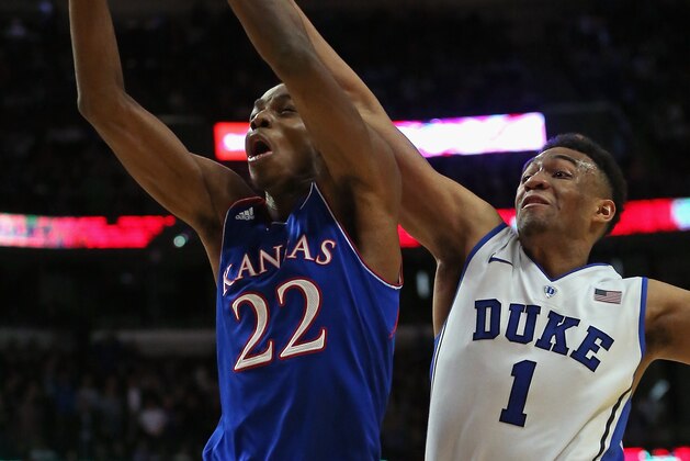 CHICAGO, IL - NOVEMBER 12:  Andrew Wiggins #22 of the Kansas Jayhawks goes up for a shot under pressure from Jabari Parker #1 of the Duke Blue Devils during the State Farm Champions Classic at the United Center on November 12, 2013 in Chicago, Illinois. Kansas defeated Duke 94-83.  (Photo by Jonathan Daniel/Getty Images)