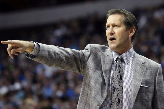 Phoenix Suns head coach Jeff Hornacek points from the sidelines during the first half of an NBA basketball game against the Dallas Mavericks, Saturday, April 12, 2014, in Dallas. (AP Photo/LM Otero)