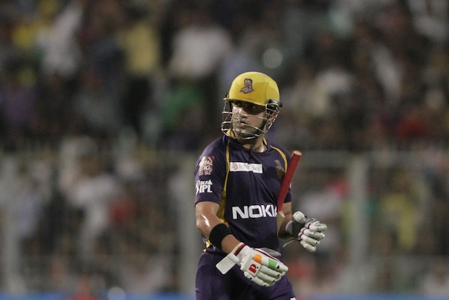Kolkata Knight Riders' captain Gautam Gambhir looks back as he walks to pavilion after his dismissal during an Indian Premier League (IPL) cricket match against Chennai Super Kings' in Kolkata, India, Monday, May 14, 2012. (AP Photo/Bikas Das)
