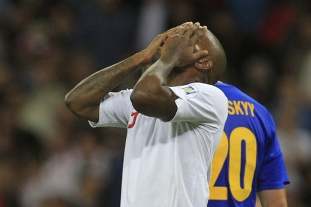 England's Jermain Defoe reacts to England's missed chance to score against Ukraine during their group H 2014 World Cup qualifying soccer match at Wembley Stadium, London, Tuesday, Sept. 11, 2012. (AP Photo/Sang Tan)