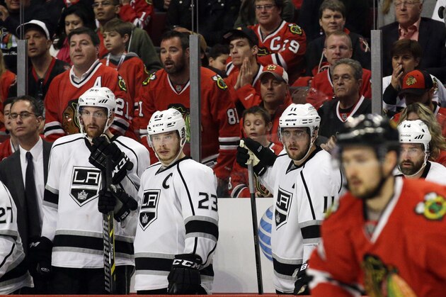 Los Angeles Kings players react as they watch teammates during the third period of Game 1 of the Western Conference finals in the NHL hockey Stanley Cup playoffs against the Chicago Blackhawks in Chicago on Sunday, May 18, 2014. The Blackhawks won 3-1. (AP Photo/Nam Y. Huh)