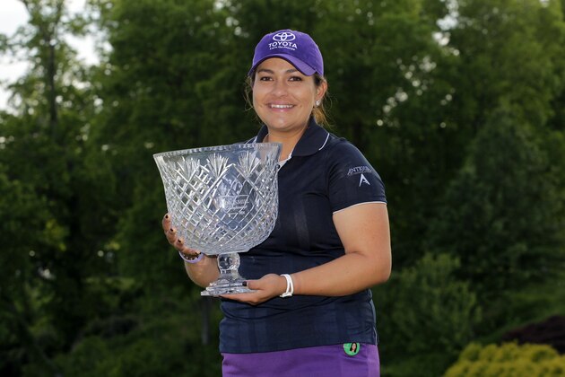 WILLIAMSBURG, VA - MAY 18: Lizette Salas holds the championship trophy after winning the Kingsmill Championship presented by JTBC on the River Course at Kingsmill Resort on May 18, 2014 in Williamsburg, Virginia. (Photo by Hunter Martin/Getty Images)