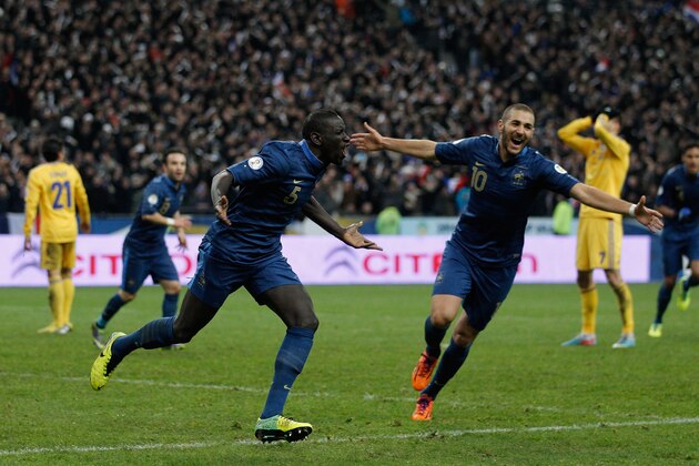 PARIS, FRANCE - NOVEMBER 19:  Mamadou Sakho of France celebrates scoring his side's third goal during the FIFA 2014 World Cup Qualifier 2nd Leg Playoff between France and Ukraine at the Stade de France on November 19, 2013 in Paris, France.  (Photo by Harry Engels/Getty Images)