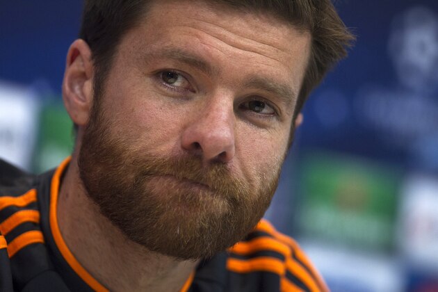 Real's Xabi Alonso attends a news conference after a training session in Madrid, Spain, Tuesday, April 22, 2014. Real Madrid will face Bayern Munich in a first leg semifinal Champions League soccer match on Wednesday. (AP Photo/Gabriel Pecot)