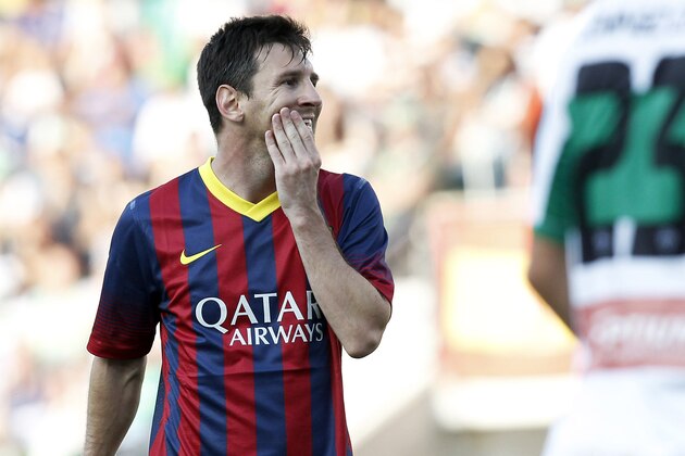 Barcelona's Lionel Messi from Argentina reacts after failing to score against Elche during a Spanish La Liga soccer match at the Martinez Valero stadium in Elche, Spain, on Sunday, May 11, 2014. (AP Photo/Alberto Saiz)