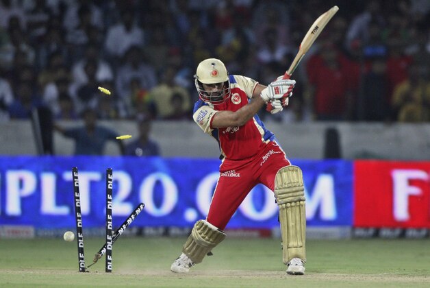 Royal Challengers Bangalore's Zaheer Khan is bowled by Deccan Chargers bowler Dale Steyn during their Indian Premier League (IPL) cricket match in Hyderabad, India, Sunday, May 20, 2012. (AP Photo/Mahesh Kumar A.)