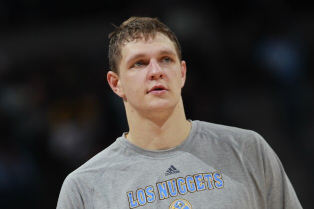 Denver Nuggets center Timofey Mozgov, of Russia, warms up before facing the Los Angeles Lakers in the third quarter of the Nuggets' 134-126 victory in an NBA basketball game in Denver on Friday, March 7, 2014. (AP Photo/David Zalubowski)