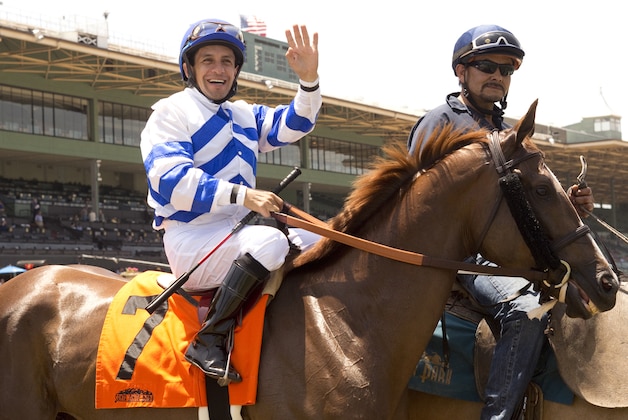 This photo provided by Benoit Photo shows jockey Victor Espinoza on Remarkable Moon at Santa Anita Park in Arcadia, Calif., Sunday, May 18, 2014. Espinoza rode California Chrome to victory in the Preakness Stakes in Baltimore on Saturday. (AP Photo/Benoit Photo)