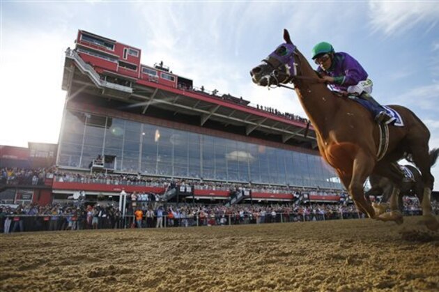California Chrome, ridden by jockey Victor Espinoza, wins the 139th Preakness Stakes horse race at Pimlico Race Course, Saturday, May 17, 2014, in Baltimore.  (AP Photo/Matt Slocum)