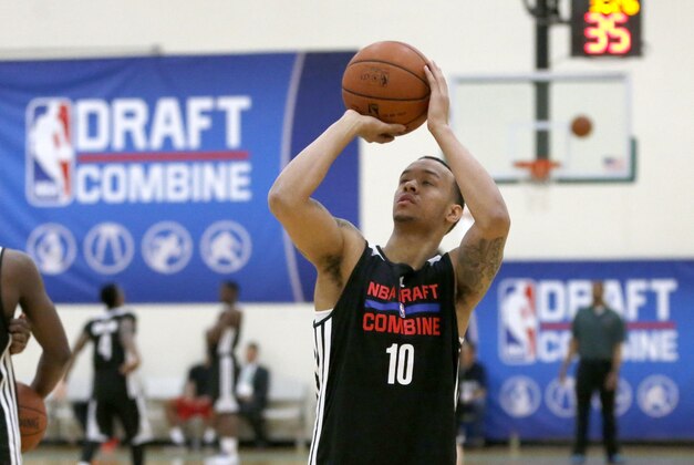 Shabazz Napier, from Connecticut, warms up before participating in the 2014 NBA basketball draft combine Friday, May 16, 2014, in Chicago. (AP Photo/Charles Rex Arbogast)