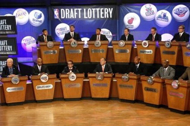 FILE - In this May 21, 2013 file photo, NBA basketball team representatives sit onstage at the start of the NBA draft lottery in New York. The draft lottery is Tuesday, May 20, 2014, a night some teams appeared to be aiming toward for months during a season featuring plenty of talking about tanking. The winner gets the No. 1 pick in next month's draft, when an Andrew Wiggins or Jabari Parker might make all of this season's misery worth it. (AP Photo/Jason DeCrow, File)