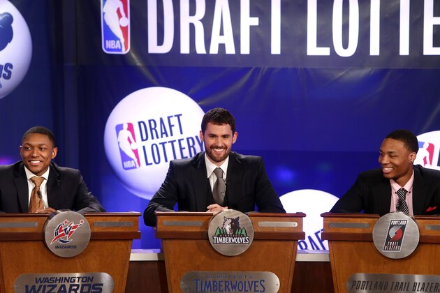 NBA basketball players, from left, Washington Wizards' Bradley Beal, Minnesota Timberwolves' Kevin Love and Portland Trailblazers' Damian Lillard represent their teams during the NBA draft lottery, Tuesday, May 21, 2013 in New York. (AP Photo/Jason DeCrow)