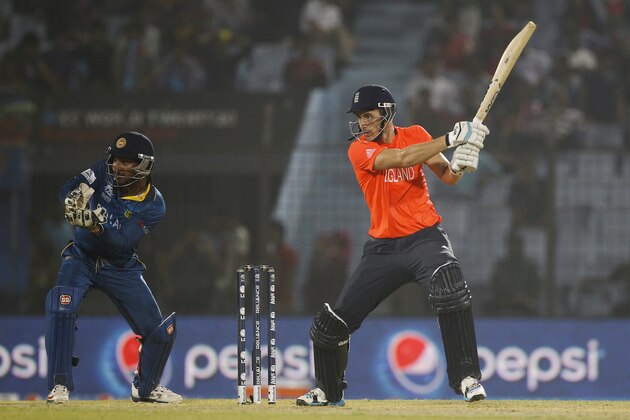 England's Alex Hales, right, plays a shot, as Sri Lanka's Kumar Sangakkara follows the ball during their ICC Twenty20 Cricket World Cup match in Chittagong, Bangladesh, Thursday, March 27, 2014. (AP Photo/A.M. Ahad)