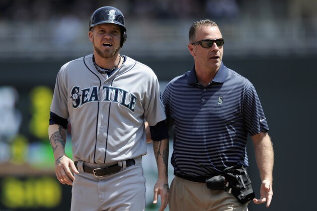 MINNEAPOLIS, MN - MAY 18: Corey Hart #27 of the Seattle Mariners leaves the game with an injury after stealing second base during the fourth inning of the game against the Minnesota Twins on May 18, 2014 at Target Field in Minneapolis, Minnesota. The Mariners defeated the Twins 6-2. (Photo by Hannah Foslien/Getty Images)