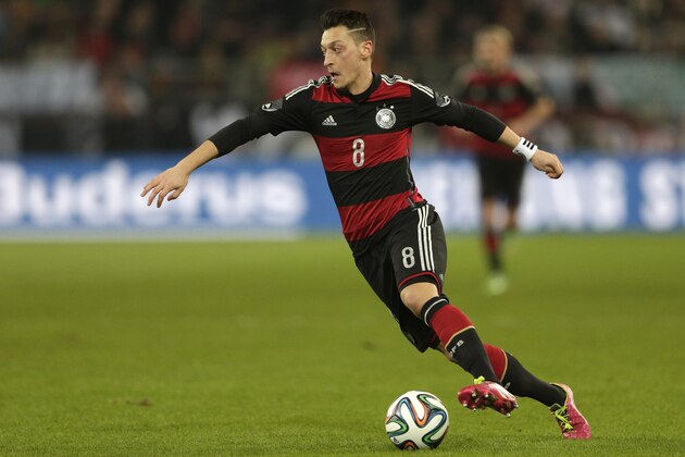 Germany's Mesut Oezil controls the ball during the international friendly soccer match between Germany and Chile in Stuttgart, Germany, Wednesday, March 5, 2014. (AP Photo/Matthias Schrader)