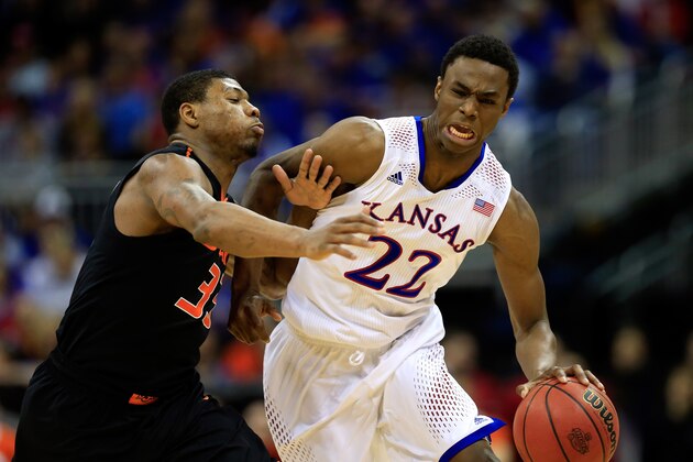 KANSAS CITY, MO - MARCH 13:  Andrew Wiggins #22 of the Kansas Jayhawks drives upcourt as Marcus Smart #33 of the Oklahoma State Cowboys defends during the Big 12 Basketball Tournament quarterfinal game at Sprint Center on March 13, 2014 in Kansas City, Missouri.  (Photo by Jamie Squire/Getty Images)