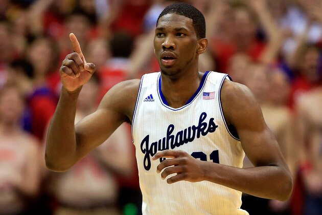 LAWRENCE, KS - JANUARY 18:  Joel Embiid #21 of the Kansas Jayhawks reacts after scoring during the game against the Oklahoma State Cowboys at Allen Fieldhouse on January 18, 2014 in Lawrence, Kansas.  (Photo by Jamie Squire/Getty Images)