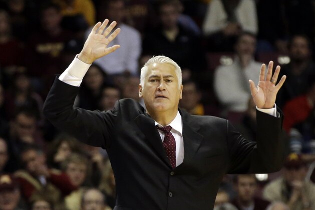 Montana head coach Wayne Tinkle directs his team in the first half of an NCAA college basketball game against Minnesota, Tuesday, Nov. 12, 2013 in Minneapolis. (AP Photo/Jim Mone)