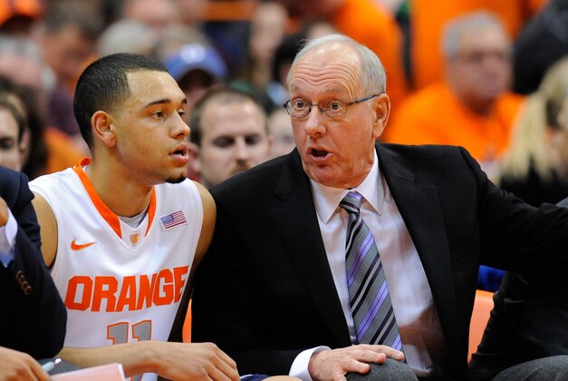 Feb 3, 2014; Syracuse, NY, USA; Syracuse Orange head coach Jim Boeheim (right) talks with guard Tyler Ennis (left) against the Notre Dame Fighting Irish during the first half at the Carrier Dome.  Syracuse defeated Notre Dame 61-55.  Mandatory Credit: Rich Barnes-USA TODAY Sports