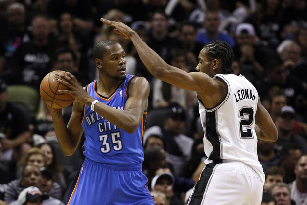 May 19, 2014; San Antonio, TX, USA; Oklahoma City Thunder forward Kevin Durant (35) is defended by San Antonio Spurs forward Kawhi Leonard (2) in game one of the Western Conference Finals in the 2014 NBA Playoffs at AT&T Center. The Spurs won 122-105. Mandatory Credit: Soobum Im-USA TODAY Sports