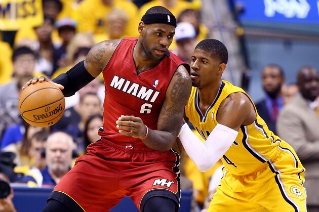 INDIANAPOLIS, IN - MAY 18:  Paul George #24 of the Indiana Pacers defends against LeBron James #6 of the Miami Heat during Game One of the Eastern Conference Finals of the 2014 NBA Playoffs at Bankers Life Fieldhouse on May 18, 2014 in Indianapolis, Indiana. NOTE TO USER: User expressly acknowledges and agrees that, by downloading and or using this photograph, User is consenting to the terms and conditions of the Getty Images License Agreement.  (Photo by Andy Lyons/Getty Images)