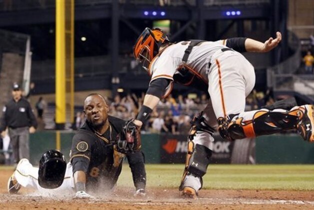 10ThingstoSeeSports - Pittsburgh Pirates' Starling Marte, left, scores ahead of the tag by San Francisco Giants catcher Buster Posey in the ninth inning of a baseball game in Pittsburgh, Tuesday, May 6, 2014. Marte was called out initially by home plate umpire Quinn Wolcott, but the call was overturned upon review. It was a walk-off triple, and an error, that allowed Marte to score. The Pirates won 2-1. (AP Photo/Gene J. Puskar, File)