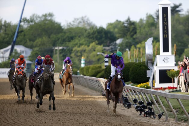 May 17, 2014; Baltimore, MD, USA; Victor Espinoza aboard California Chrome celebrates winning the 139th Preakness Stakesat Pimlico Race Course. Mandatory Credit: Winslow Townson-USA TODAY Sports