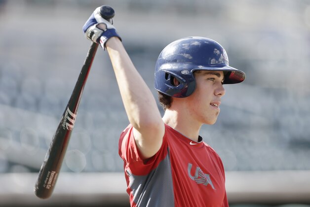 United States' Bradley Zimmer warms up before an exhibition game against Cuba, Thursday, July 18, 2013, in Des Moines, Iowa. The teams are to play a five-game series over the next week. (AP Photo/Charlie Neibergall)