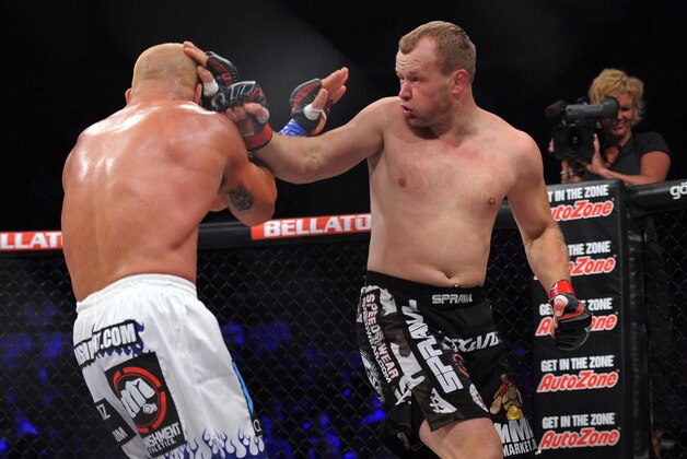 May 17, 2014; Southaven, MS, USA; Alexander Shlemnko (red gloves) fights against  Tito Ortiz (blue gloves) during BFC 120 at Landers Center. Mandatory Credit: Justin Ford-USA TODAY Sports